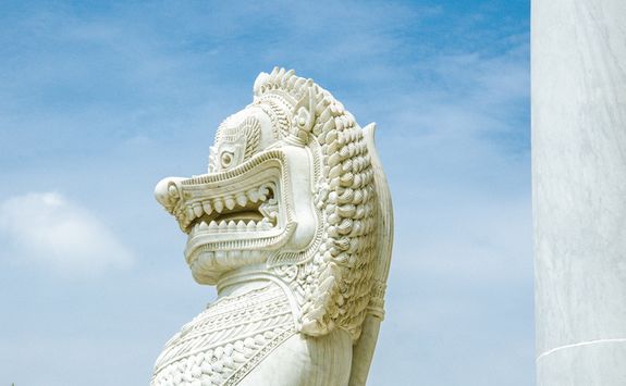 Marble lion guarding temple