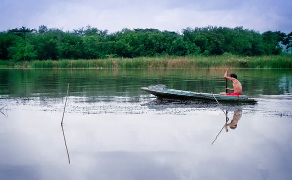 Man paddling in the river