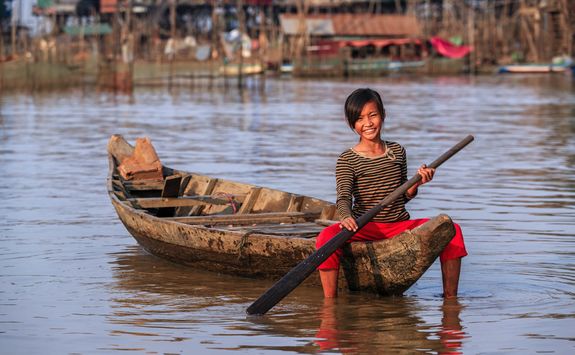 Girl in boat on Tonle Sap lake