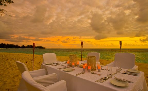 a sunset dinner on the beach