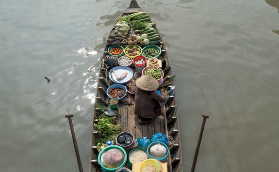 A woman in floating market Cai Rang, Can Tho
