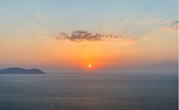 Sun setting at sea