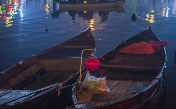 Colourful lantern over rowboats