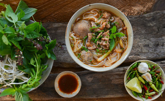 pho vietnames beef soup on a wooden background