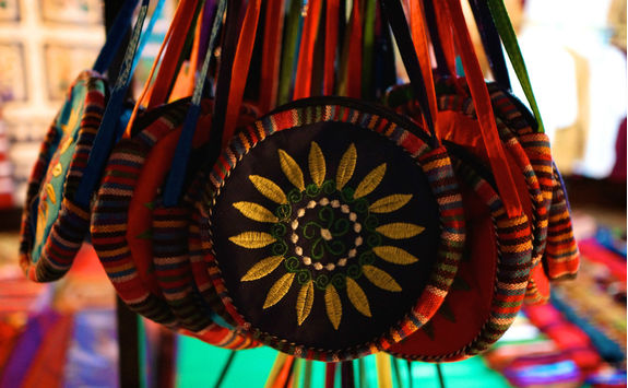 purses at a market in laos