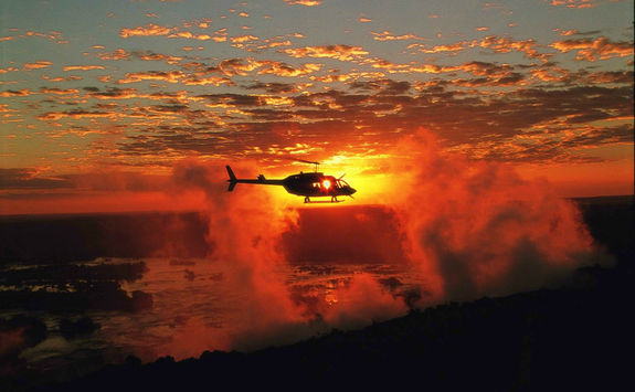 Helicopter over the Victoria Falls at sunset