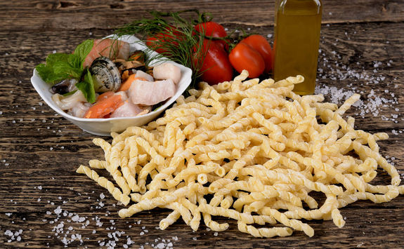 raw busiate with fish dressing