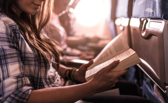 women reading in a plane