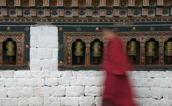 monk and praying wheels