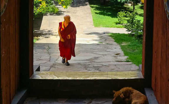 view of a monk through door