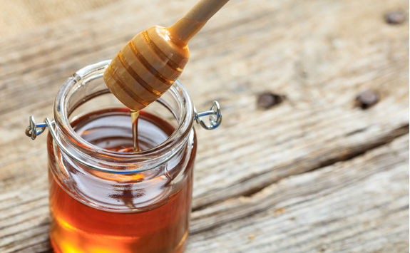 Glass jar with honey