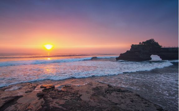 temple in sea at sunset