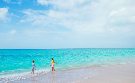 Girls playing on a beach in Antigua