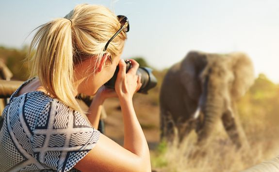 Woman capturing an elephant