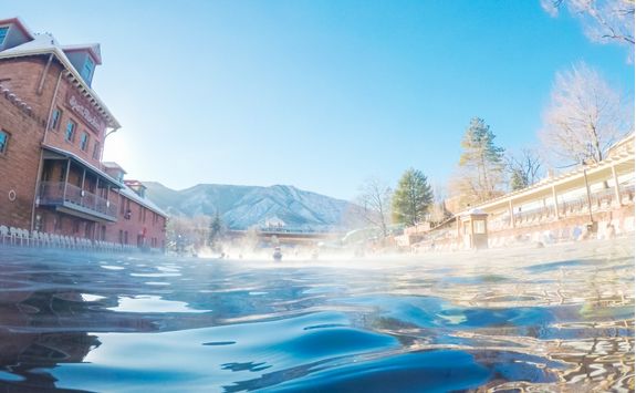 Swimming in outdoor hot springs pool