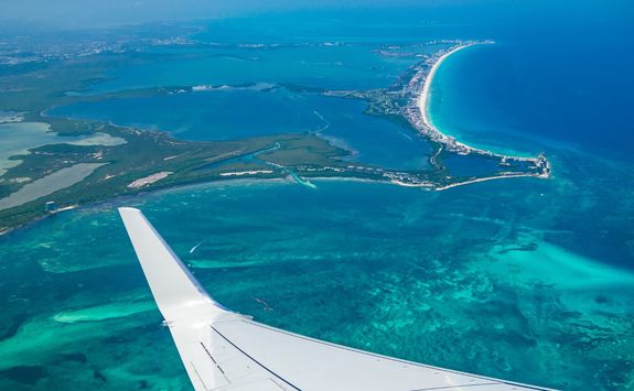 plane over cancun