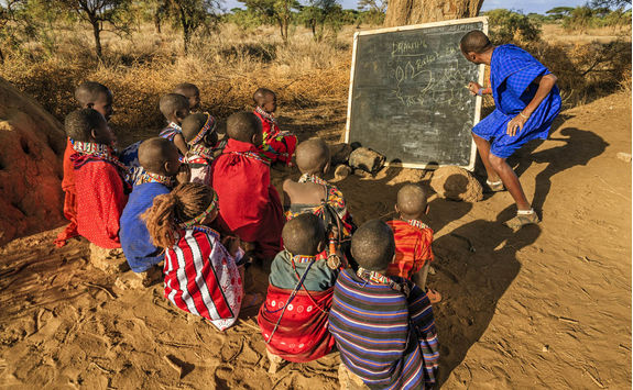 African children in the school under tree