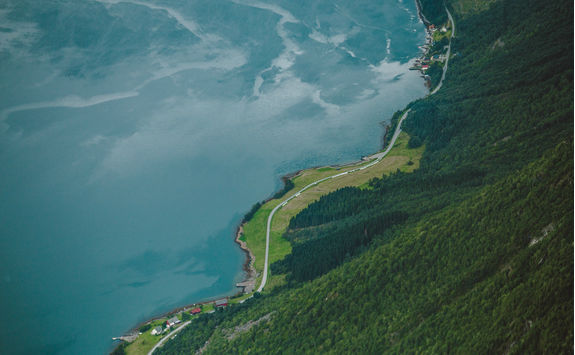Curvy road by fjord in Norway