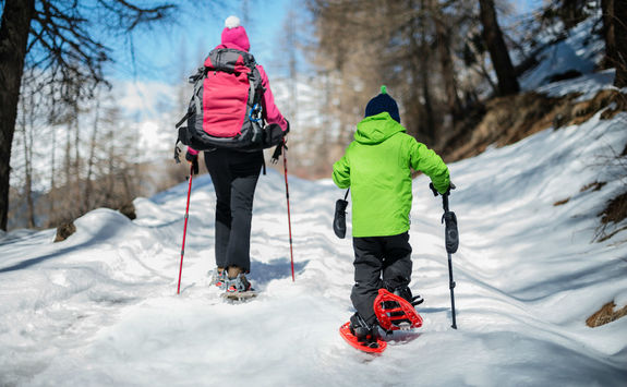 Woman and child snowshoeing outdoor