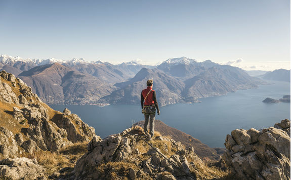 Hiker on top of the mountain above Lake Como