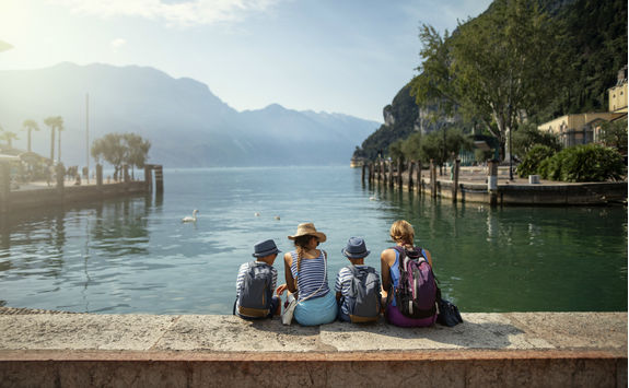 Family sitting enjoying view of lake Garda