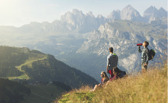 Teenagers taking a break during trail in the Dolomites