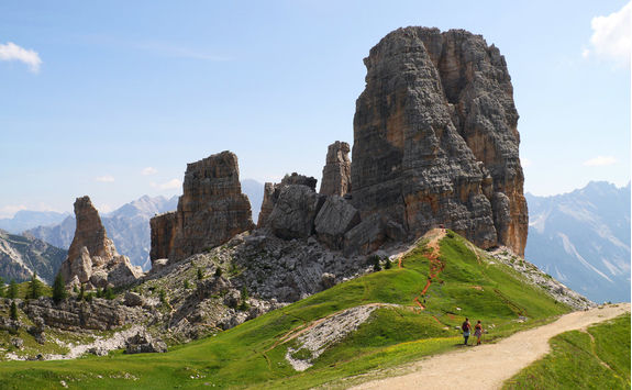 Hikers in front of Five Towers in the Dolomites