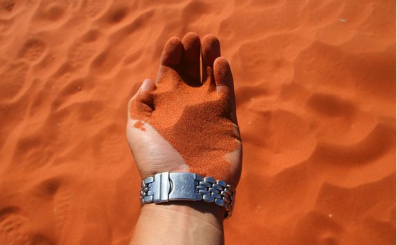 Red sand in hand