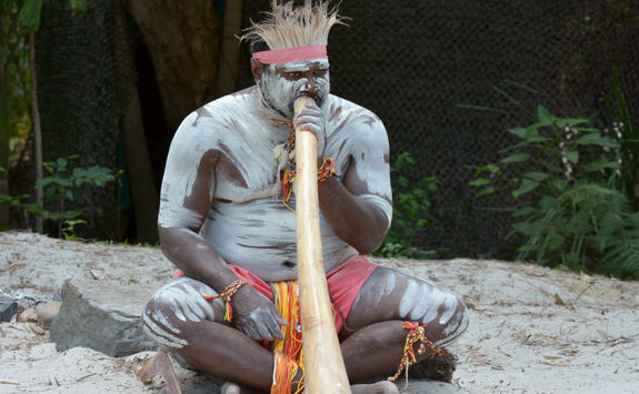 Aboriginal playing didgeridoo