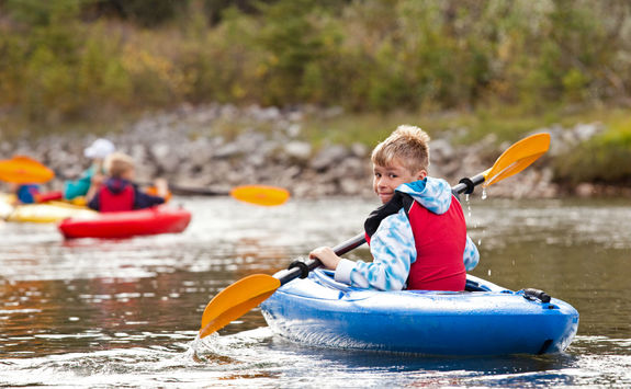 Young boy kayaking in British Columbia