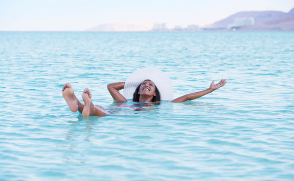 woman floating dead sea