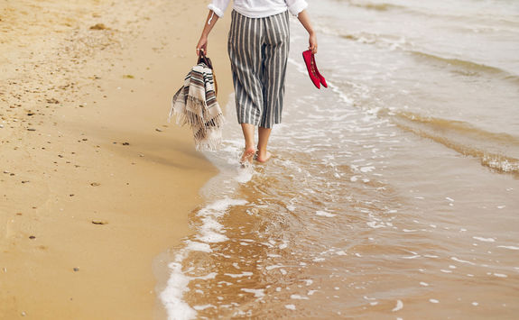 woman walking on beach
