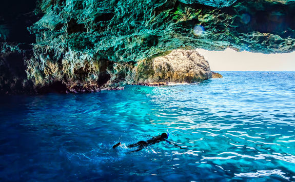 swimming in sea cave