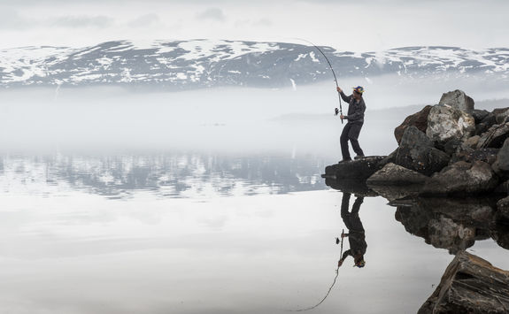 man fly fishing