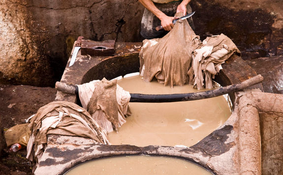 man working in a tannery