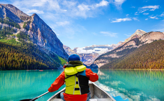 child canoeing lake louise