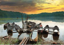 tamblingan lake boats at sunset