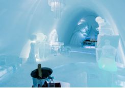 Enjoy champagne in the Icehotel room
