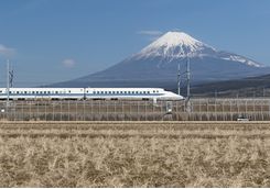 Bullet train travelling past Mount Fuji