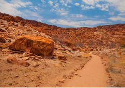 A desert road going through the twyfelfonteim landscape