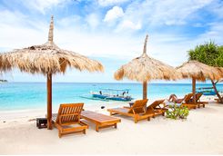 Sun loungers and umbrella on Lombok beach