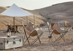 Chairs in the desert at Scarabeo Stone Desert Camp