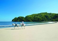 Riding on the beach at the Shangri-La Rasa Ria