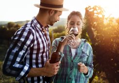 Two persons are tasting wine