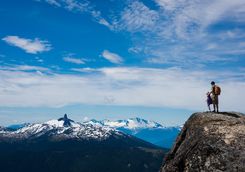 Father and daughter enjoying the mountain view