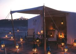 Dar Ahlam tent at night with candles