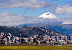 a view of Quito with a volcano in the background