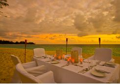 a sunset dinner on the beach