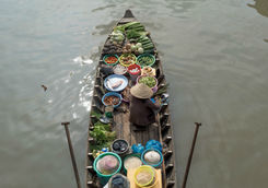 A woman in floating market Cai Rang, Can Tho