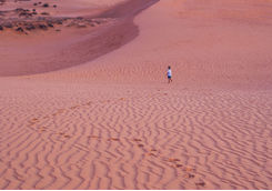 Child in the desert dunes